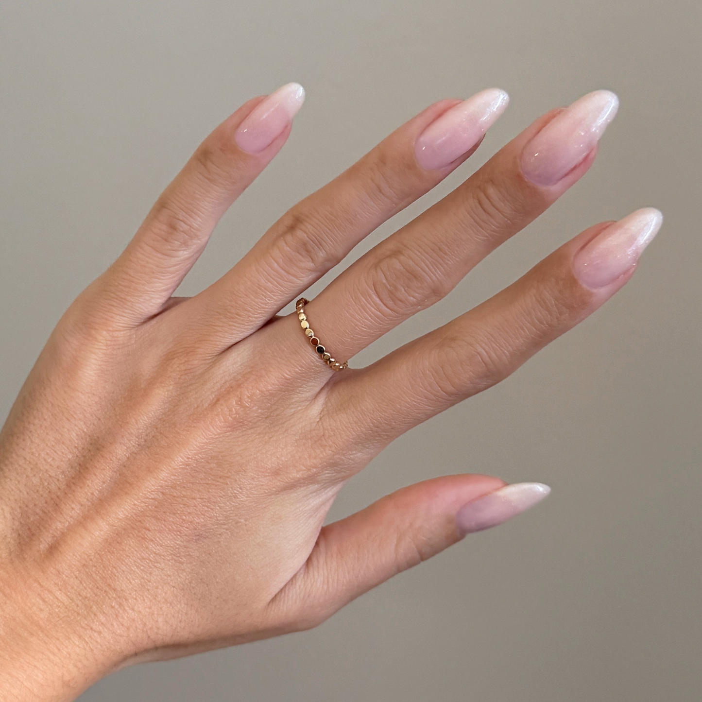 Soft Tint - Builder Gel on long natural nails with subtle sheer blush pink and delicate silver shimmer manicure