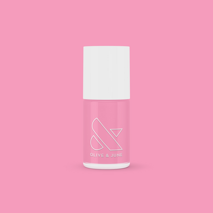 Bottle of Grateful & Kind pure pink gel polish by Olive and June for long-lasting at-home manicures