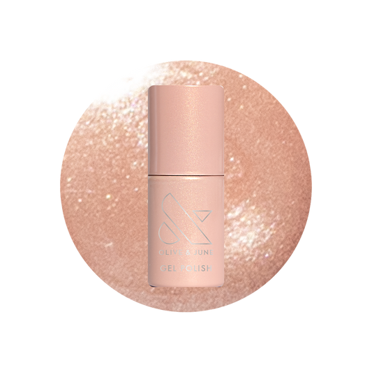 Cookie Swap Gel shimmery beige champagne gel polish bottle on sparkling background for a polished manicure