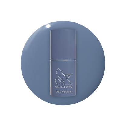 Bottle of Slate - Gel polish in midtone slate blue with a calm and chic finish against a white background