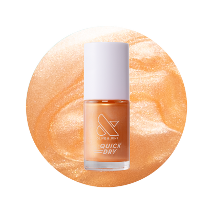 Bottle of Sunlit warm golden peach shimmer quick dry gel polish by Olive and June on peach shimmer background